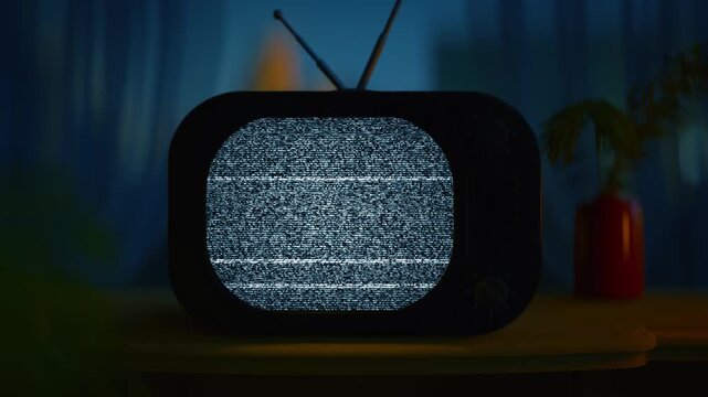 A cinematic, moody close-up of a vintage retro CRT television set glowing in a dimly lit blue room. The screen is filled with black and white static noise and tracking lines. 3D Render Animation