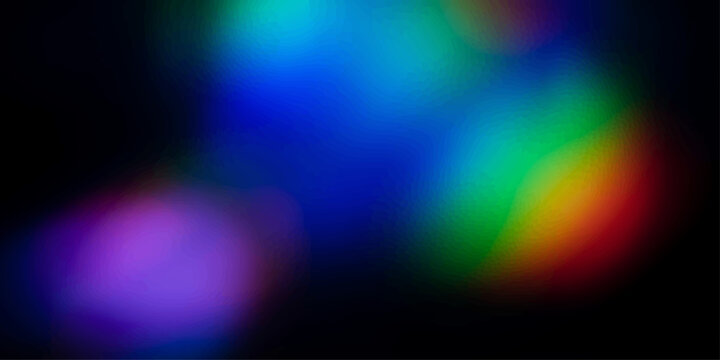 Abstract bokeh lights with a prism effect, creating a dreamy and vibrant overlay of color on a dark background.