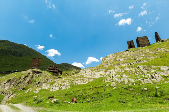 Tusheti summer landscape with ancient towers in Georgia for hiking, trekking.