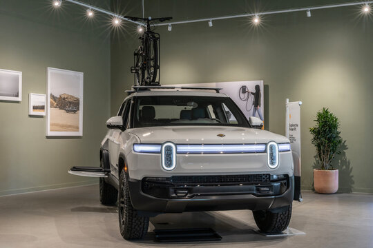 Rivian R1T Electric Truck display at a service center. Rivian offers the R1T with up to 420 miles driving range. MY:2026