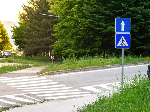 Crosswalk road marking. Traffic sign outdoor. Urban asphalt lines. Street safety zone. White painted stripes. City infrastructure element. Highway security indicator. Walkway path guide