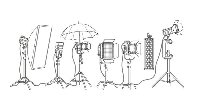 Studio lights and reflectors arranged on tripods indoors