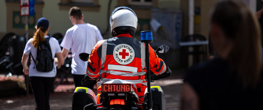 fulda, hesse, germany - 09 05 2026: a motorcyclist of the german red cross at an event