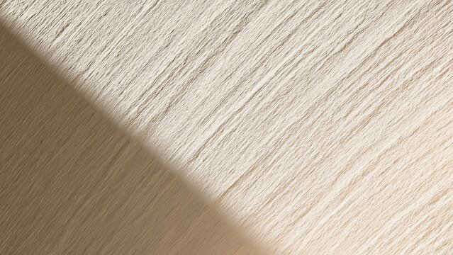 Minimal beige textured surface with soft diagonal shadow