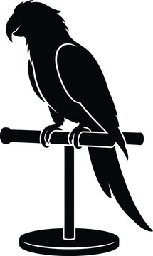 Black silhouette of a tropical macaw parrot perched on a t-shaped stand