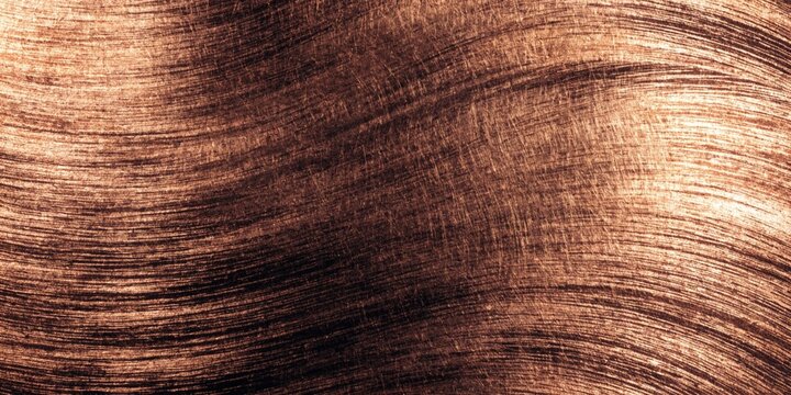 Brushed metallic texture a copper toned background with swirling linear patterns and a grainy surface abrasive abstract aluminum