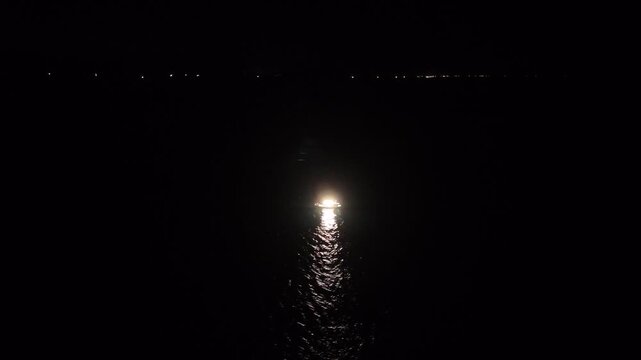 Aerial View of Illuminated Squid Fishing Boat at Night Offshore Hagi Japan, 4K Marine Industry Footage 04