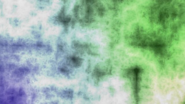 Abstract swirling green and blue ink patterns in water