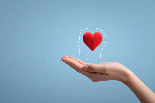 Mental Health Awareness,Mental Wellness,Mental Health and Well-Being,Positive thinking concept.,Hand hodling human head with heart idea for lifestyle. 