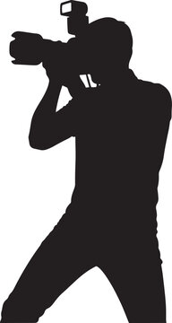 Silhouette of a professional photographer using a camera with flash