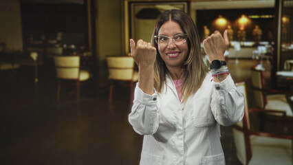 Obraz premium Woman doctor in white coat reaches forward with open hands in restaurant dining room; compassion reassurance.