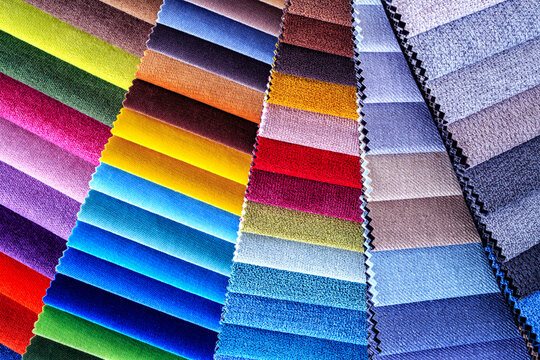 Catalogs of furniture fabrics textile sample for renovation.Velvet and textile fabric swatches in different shades and tones for furniture and home interior use.Furniture fabric collection