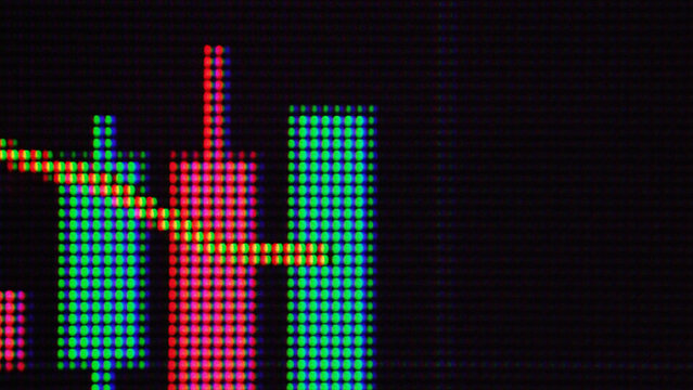 Macro Close-Up of Financial Candlestick Chart on LCD Screen