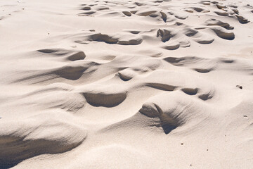 Sand beach texture and sand formations at the Lubiatowskie Dunes Beach, Baltic Sea, Lubiatowo, Poland © Aneta