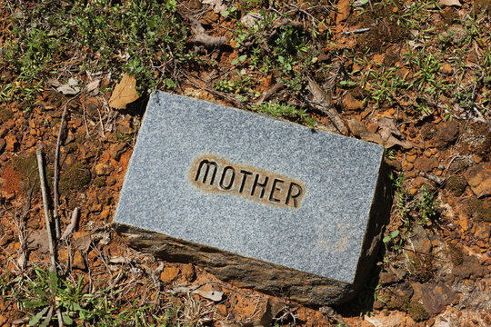Brick Stone in Cemetery With Word Mother Engraved