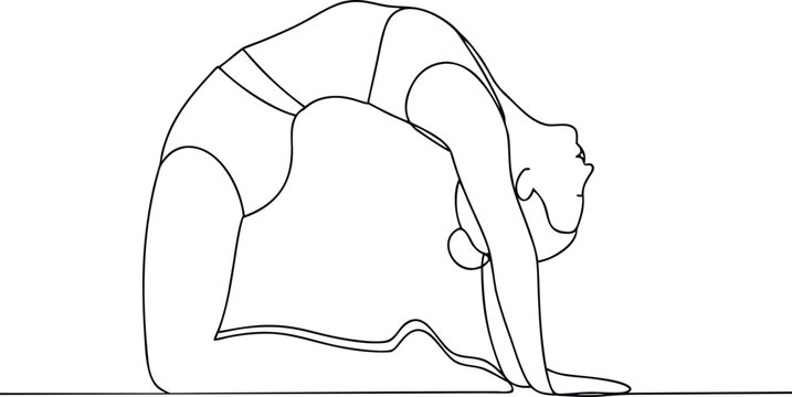 Woman practicing yoga, performing camel pose, arching back and reaching for heels.