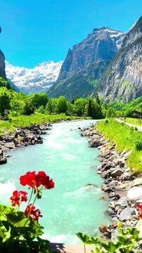 Aerial drone view of the spectacular Lauterbrunnen valley with steep cliffs and waterfalls in Switzerland