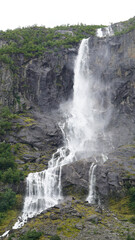 Obraz premium Green Misty Mountain and Glacier landscapes near Briksdal Glacier in Norway
