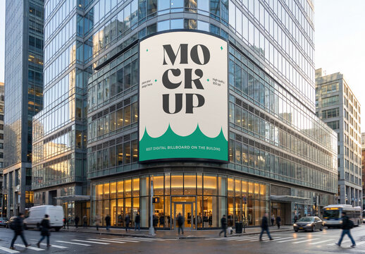 Eye-level perspective view of a massive curved vertical digital LED billboard mockup mounted on the glass corner facade of a modern skyscraper building in a busy city intersection
