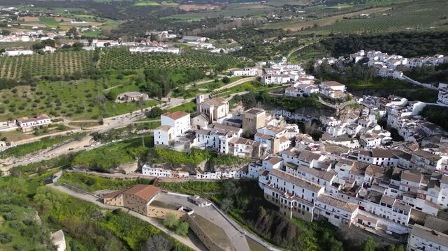 Aerial Drone Orbiting Main Church and Cave Houses of Setenil de las Bodegas, Andalusia, Spain