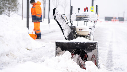 Obraz premium Snowy street clears with mechanical snow plow