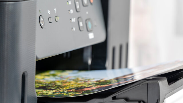 Printer ejects vibrant landscape photo with natural colors and fine detail