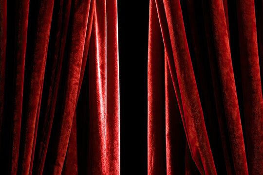 Rich red velvet curtains parting to reveal a dark, mysterious void