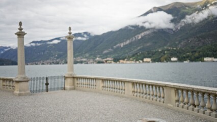 Obraz premium Lakeside terrace with stone balustrade, soft defocused bokeh background, outdoor; background backdrop copyspace calm.