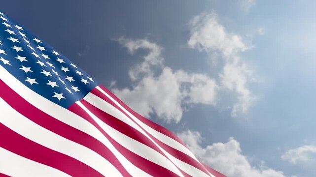 American Flag Waving Against Blue Sky and Clouds Background