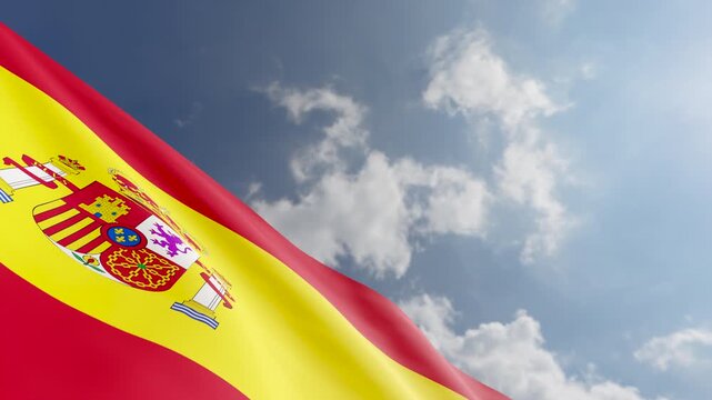 Spanish Flag Waving Against Blue Sky and Clouds Background