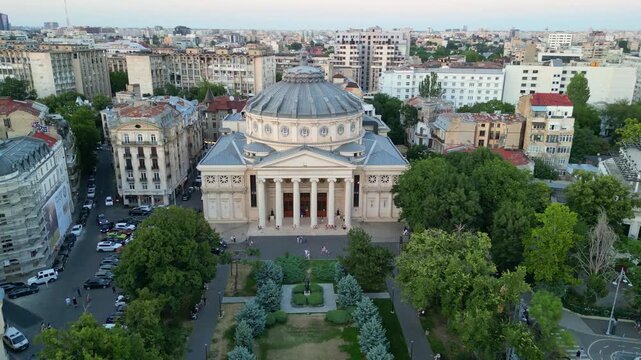 Aerial drone perspective of the Romanian Athenaeum building during daytime, historical monument and tourist attraction in Bucharest downtown, Romania.