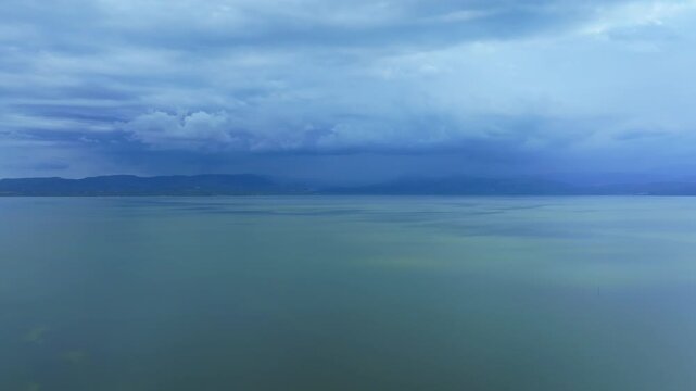 Peaceful Italian landscape showing Lago di Varano, coastal forests and the Adriatic Sea from above.