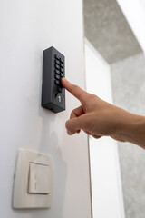 Naklejka premium Low angle perspective of smart keypad access system for automated vacation apartment self check in process