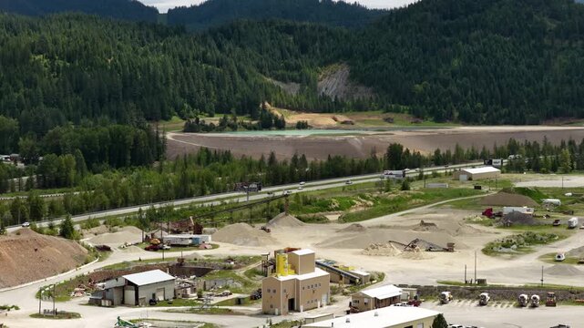 Aerial view showing the infrastructure and industrial activity in Osburn Shoshone County Idaho along Interstate 90 in spring