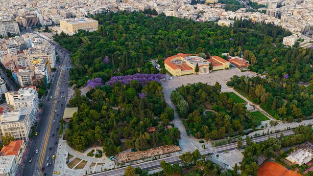 Athens cityscape showcasing the zappeion hall and surrounding national garden, a green urban oasis providing a vibrant park space in the historical capital of greece during daytime