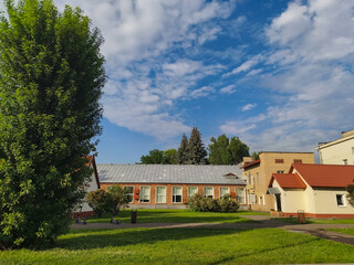 Fototapeta premium Old house in the countryside in summer day with blue sky