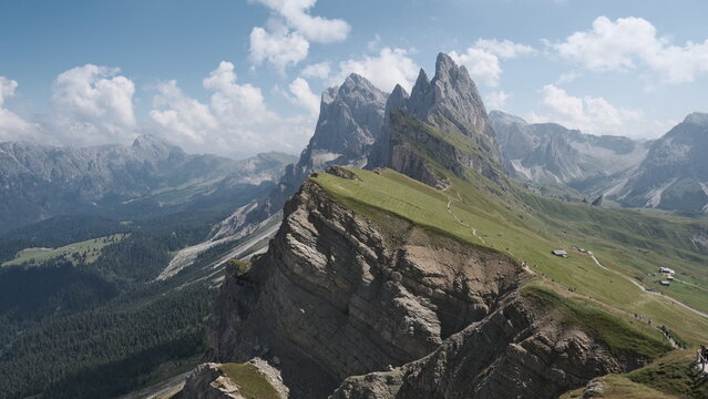 Dramatic Seceda mountain ridge leading to Odle peaks with sweeping alpine valley, Val Gardena, Dolomites, Italy &mdash; horizontal