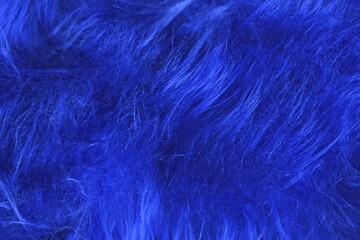 Obraz premium Close up of bright blue tousled synthetic fake fur, AI generated