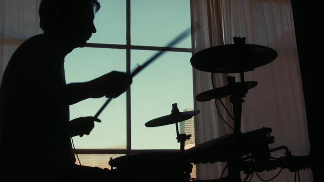 Electronic drum midi kit, Stage, performance and man on drums concert playing jazz, beat music. Man Drummer, musician and creative person percussion, instrument or show at night