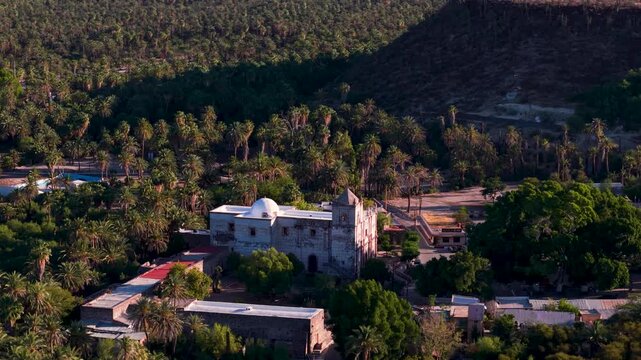 Explore the Mission Church in San Ignacio, an oasis town in Baja California, through aerial views of the area and its natural surroundings