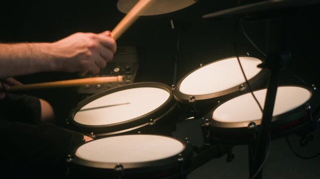 Electronic drum midi kit, Stage, performance and man on drums concert playing jazz, beat music. Man Drummer, musician and creative person percussion, instrument or show at night