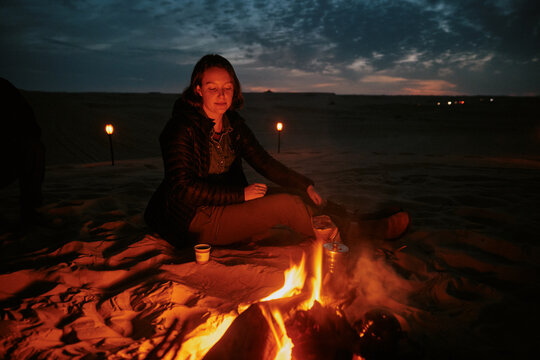 Campfire gathering at night near the desert in Egypt
