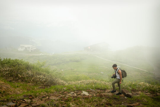 Hiker in Japanese Alps fog