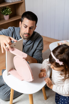 Child Observing Furniture Assembly