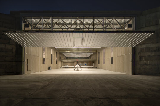 Wide Night View of Open Aircraft Hangar