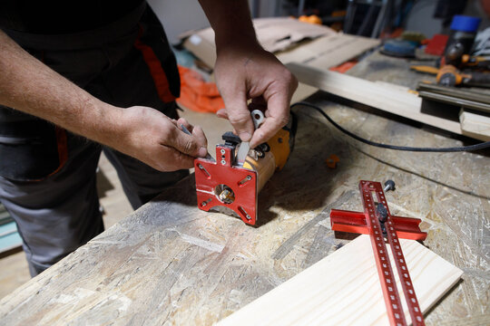 Man prepares milling machine