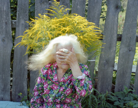 Old age woman hiding her face 3