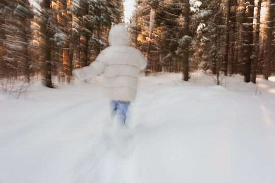Emotional Running Away in Winter Snowy Woods 