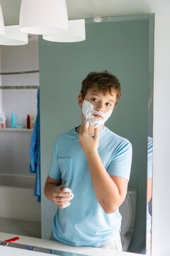 Portrait Teenager Lifestyle boy shaving first time