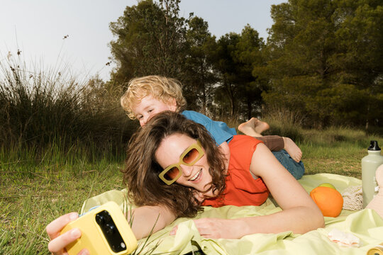 Family enjoys a colorful picnic in spring nature with fun moments